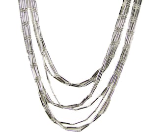 Long silver chain layered necklace with tube and bead chain. Silver multi strand layered statement necklace.