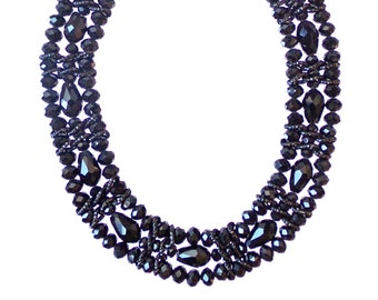 Black color glass beaded necklace with three rows of glass beads in rondelle and tube shapes connected with black textured links