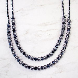 Gray pearl and glass double row necklace. It is layered and created with a gray fabric lace wrapped and intertwined between every bead.