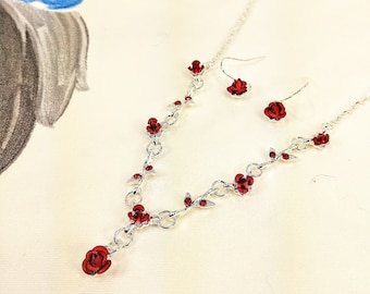 Precious red roses Y necklace and matching earring set with red crystals, red carved metal roses, and with red enamel. Red rose jewelry set
