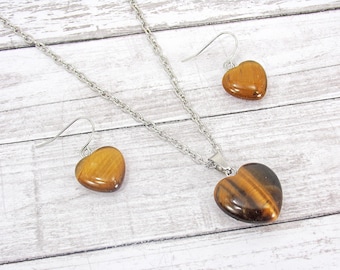 Brown tiger's eye genuine stone heart pendant necklace and earring set. Tigers eye stone heart fashion jewelry pendant and earring set.