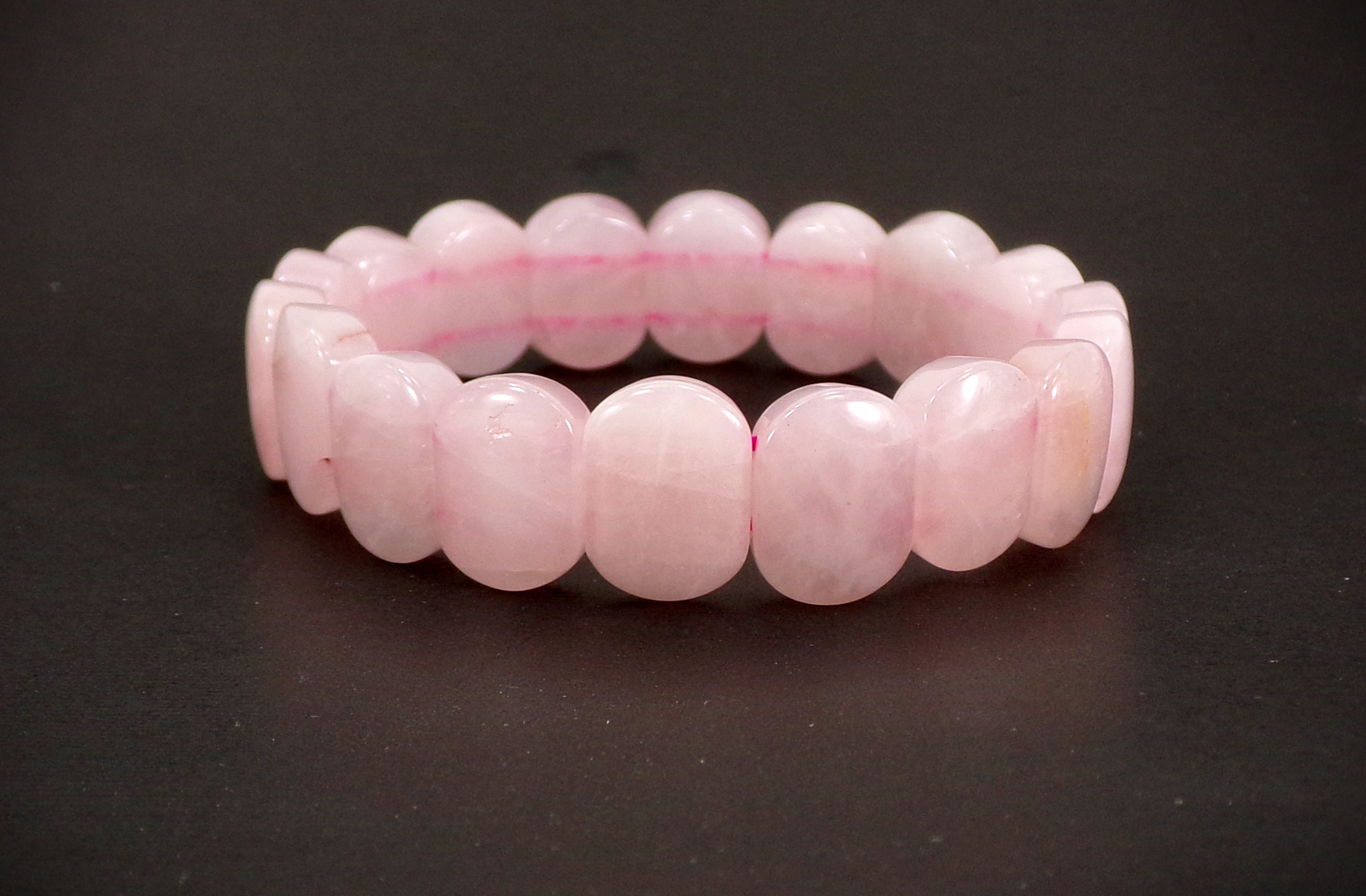 Rose pink quartz stone stretch bracelet created with oval cut stones in a polished smooth finish Pink beaded stone bracelet..