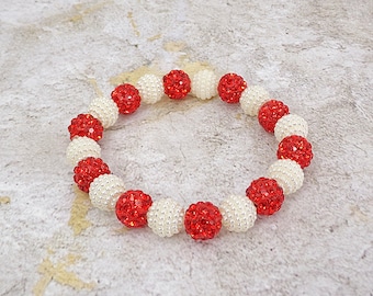 Red crystal and pearl beaded stretch bracelet with red crystal round beads and white round pearl beads.  Fashion stretch bracelet.