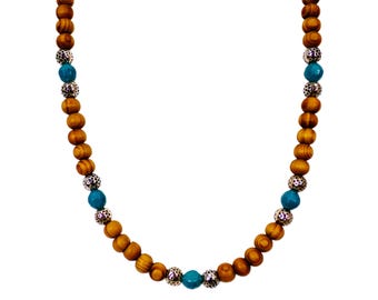 Wood bead necklace created with turquoise color beads and textured silver beads. 