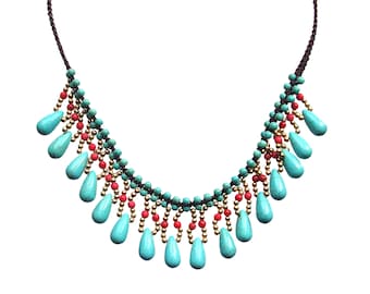 Turquoise fringe beaded necklace created with small teardrop shape stones, red agate stone, gold beads and on a brown fabric cord.