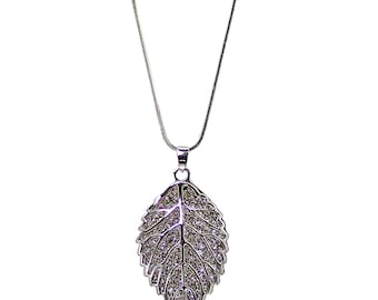 Sparkling leaf pendant necklace designed with all crystals inside a large polished silver leaf pendant. Fashion leaf necklace.