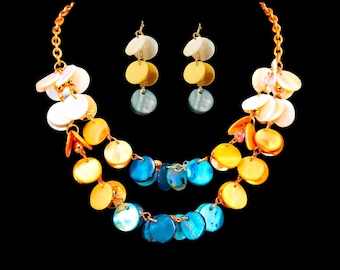 Multi color shell necklace and earring set in blue, beige, and white shell disk beads. Layered double row colorful necklace.