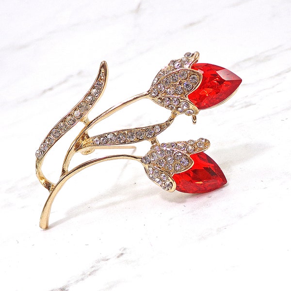 Tulip flower pin brooch with red and clear crystals.  The flowers are in red crystals and clear crystals are on the stem and leaves.