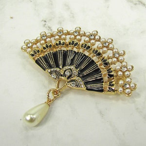 Vintage inspired and elegant fan brooch pin created with beautiful black enamel, pearls, crystals, and a faux pearl teardrop.