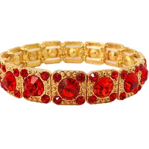 Red crystal stretch bracelet with red round crystals and gold textured bead finish.  Each square section has five red crystals set into them