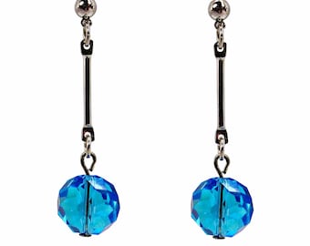 Long polished silver bar earrings with a dangling aqua blue glass round bead.  Fashion light blue earrings.