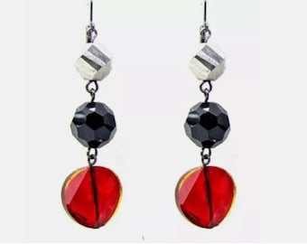 Multi color glass beaded earrings created with red, black, and gray color glass beads linked together.