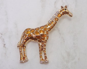 Cute giraffe brooch pin designed with light brown enamel and clear crystals. Women's brown giraffe brooch pin jewelry.
