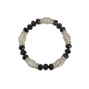 Black and white beaded stretch bracelet with black facet cut glass beads, white swirl beads, crystal spacer beads. Fashion beaded bracelet