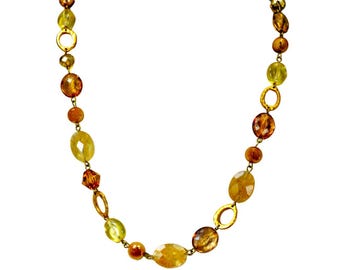 Beige bead link necklace with a mix of glass, stone, and acrylic beads and gold links.