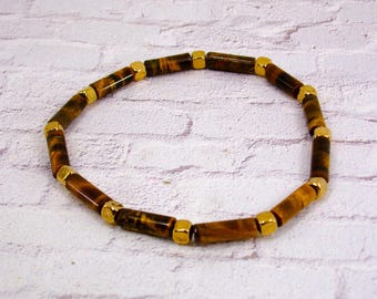 Brown tigers eye genuine stone stretch bracelet created with small gold plated square beads.