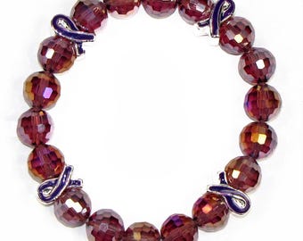 Pulsera elástica con lazo de cuentas de vidrio violeta para concienciar sobre el cáncer de páncreas.