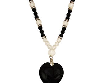 Black agate stone heart pendant necklace attached to a black and white bead necklace made with glass beads and crystal beads.