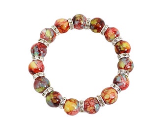Red glass beaded stretch bracelet with crystal spacer beads created with painted glass beads in multiple colors mixed with red.