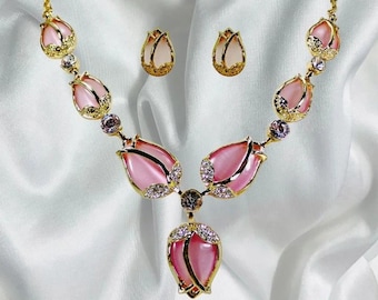 Pink tulip flower statement necklace and earring set with pink cat eye stones and clear crystals in tulip flower settings..