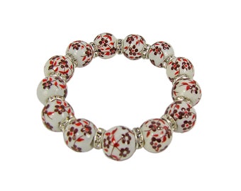 Red flower genuine porcelain bead and crystal stretch bracelet.  Porcelain beaded stretch bracelet with red flower designs.