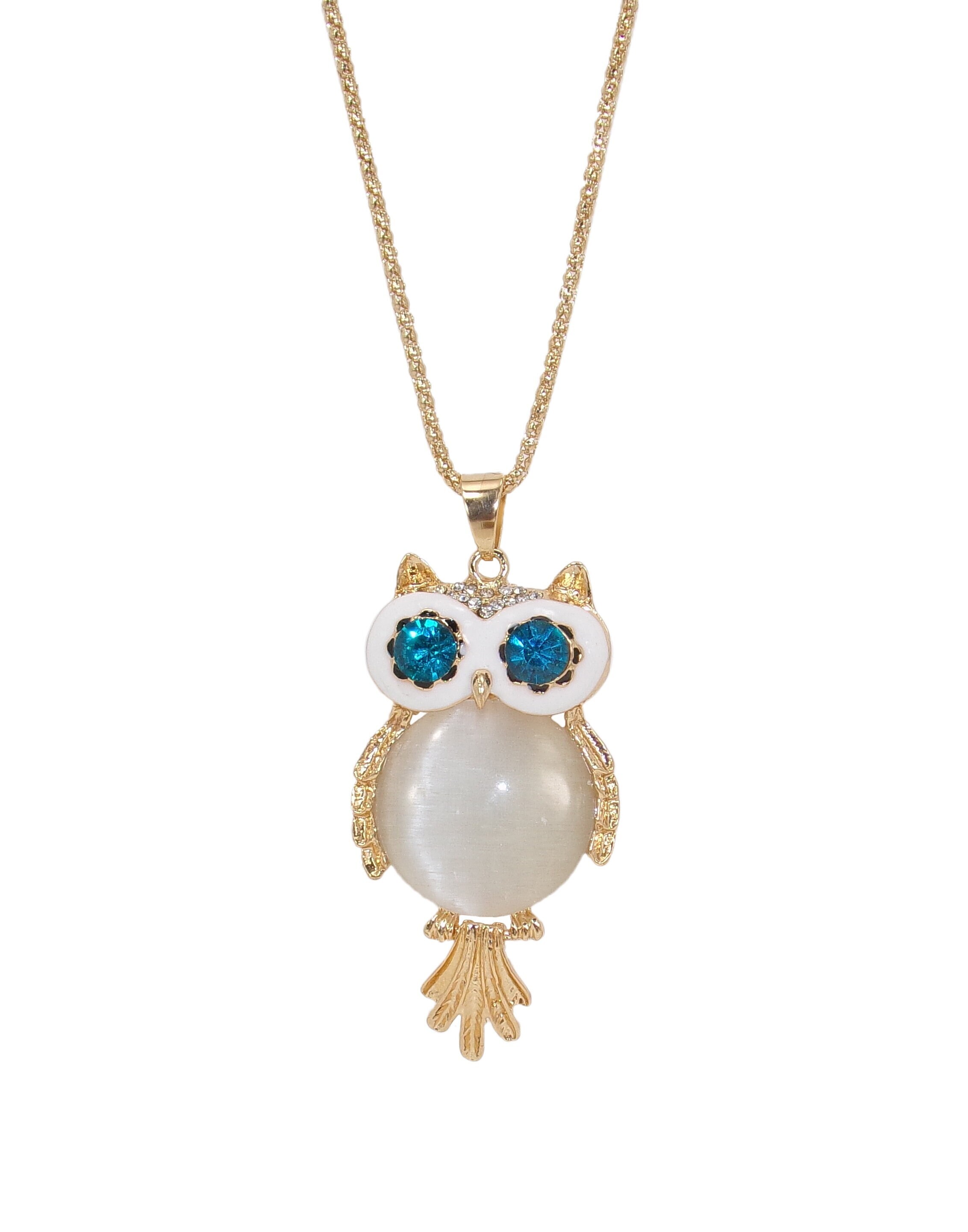 White owl pendant necklace with a round white cat eye stone center, blue crystal eyes, clear crystal
