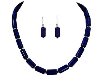 Blue bead fashion necklace and earring set designed with tube shape beads and small silver beads.