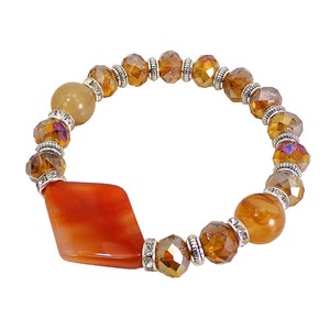 Orange Glass Beaded Stretch Bracelet designed with orange and light brown glass beads, large diamond shape glass bead & crystal spacer beads