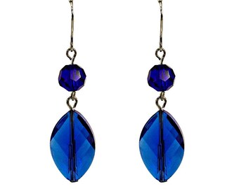 Blue glass double bead earrings designed with marquise and round shape glass beads linked together.