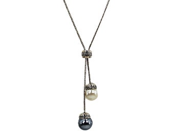 Pearl lariat necklace with white and gray round pearls on a silver snake chain