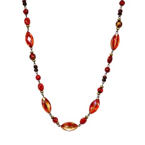 Orange glass bead necklace designed with acrylic and wood beads all hand linked  in a burnished gold finish.