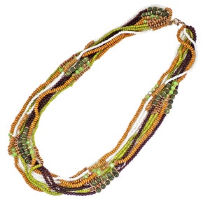 Multi strand beaded necklace in brown, green, and white colors. Created with wood beads, glass beads, and seed beads. Multi color necklace.