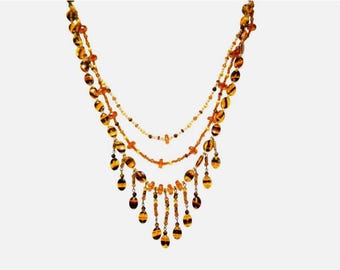 Long brown layered bead necklace designed with a mix of acrylic beads and seed beads, bohemian fringe bead necklace.