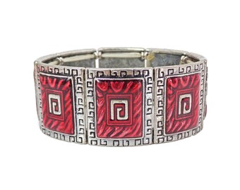 Red enamel stretch bracelet with Greek key design all around it.  It is made with square sections in a silver antique finish.