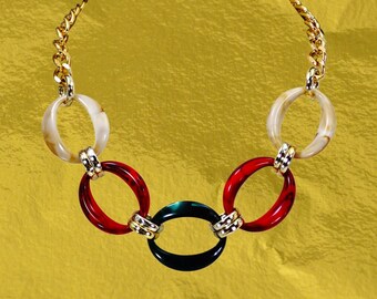 Multi color large link necklace in red, green and beige colors created with large acrylic oval links connected by round gold links - 17"