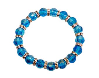 Turquoise aqua blue color glass bead stretch bracelet with crystal spacer beads. All round glass beaded fashion bracelet.