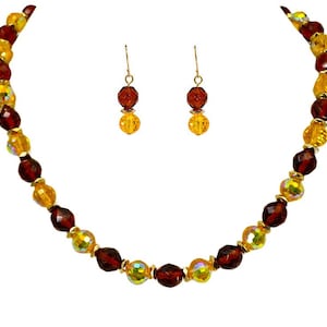 Yellow and brown all glass bead necklace and earring set mixed with gold accent beads.