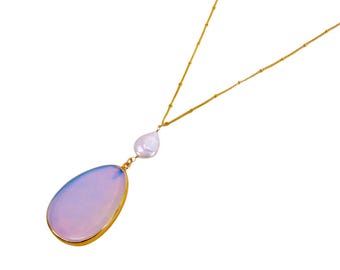 Large white translucent glass pendant necklace encased in gold and attached to a genuine white coin pearl.