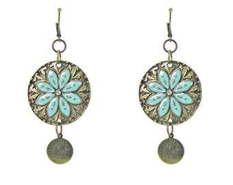 Turquoise flower disk earrings with an enamel flower hand painted on burnished gold finished disk dangling earrings.
