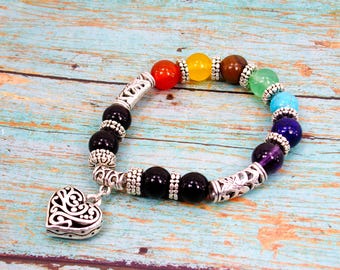 Heart charm stretch bracelet with multi color glass beads and silver antique textured beads. Fashion heart jewelry.