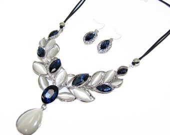 Blue crystal and white cat eye stone statement necklace and earring set designed with blue marquise and white marquise cut stones
