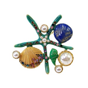 Colorful starfish pin brooch with shells, pearls, and with multi color crystals. Ocean theme handcrafted pin in green, blue, gold colors.