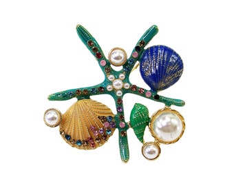 Colorful starfish pin brooch with shells, pearls, and with multi color crystals.  Ocean theme pin in green, blue, and gold colors.