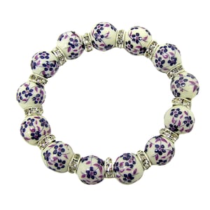 Purple flower genuine porcelain bead bracelet with crystal spacer beads.  Purple floral bracelet with flower beads.