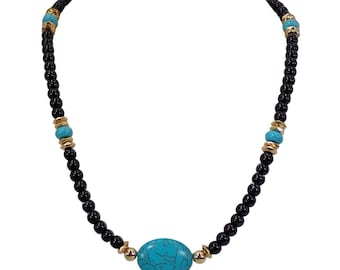 Black and turquoise bead necklace designed with black glass beads, turquoise agate stones and gold accents.