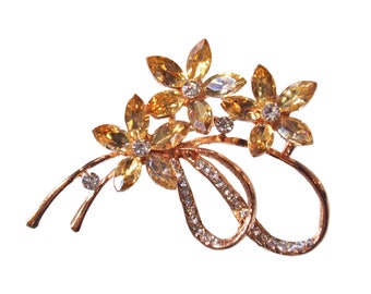 Topaz color crystal flower pin brooch created with three large crystal flowers with marquise shape crystals and clear crystals on the stem.