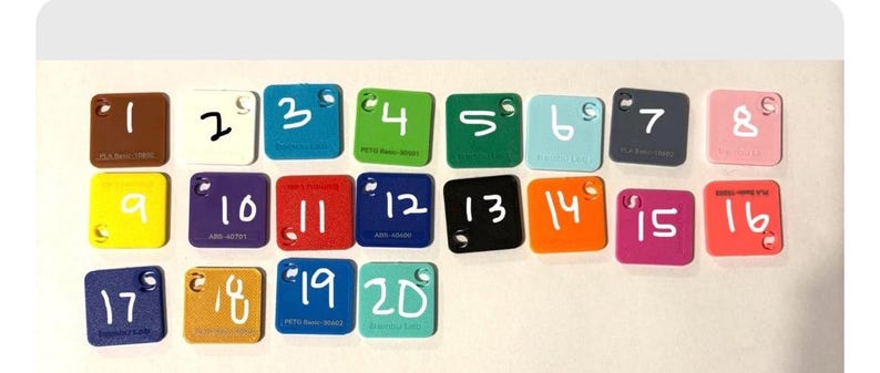 May include: Twenty square colour samples are displayed, each with a white number. The samples are in various colours, including brown, white, blue, green, teal, grey, pink, yellow, purple, red, black, orange, and coral.