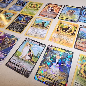 May include: A collection of colorful trading cards featuring various dog and cat illustrations. The cards have different designs, including images of dogs and cats, with text and numbers. Some cards have holographic effects.