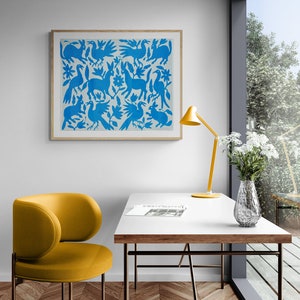 May include: A rectangular wall art piece in a light wood frame featuring a repeating pattern of blue animals and flowers on a white background. The artwork displays stylized rabbits and birds arranged in a symmetrical, folk-inspired composition.