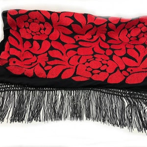 May include: Black shawl with red embroidered floral pattern and black fringe.